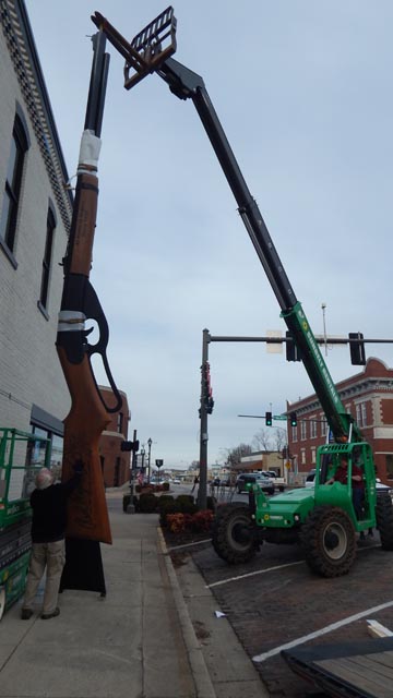 Crane lifting the World's Largest Daisy BB Gun into position